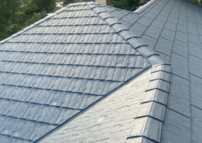 Close-up of metal slate roofing detail showing layered panel texture and finish.